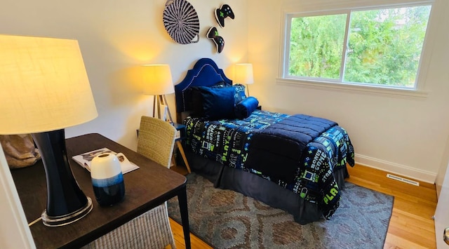 bedroom featuring wood-type flooring