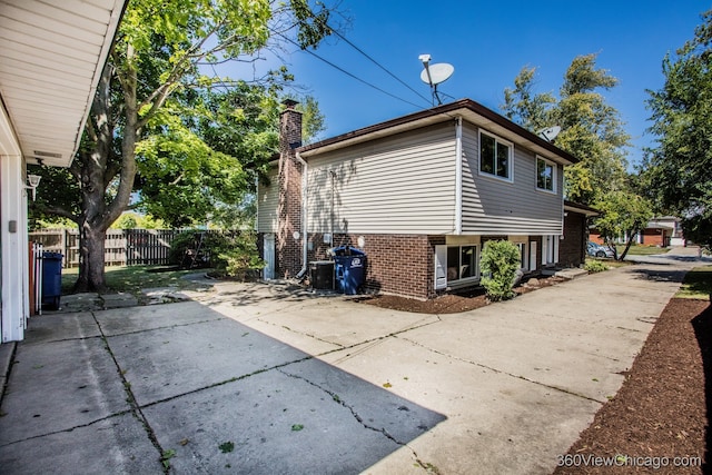 view of side of home featuring a patio area