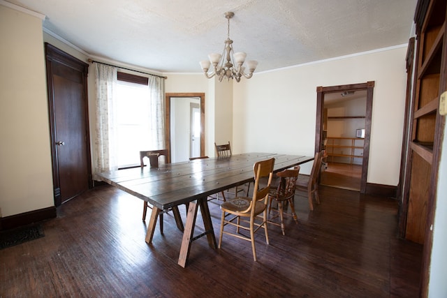 dining space with a notable chandelier, crown molding, dark wood-type flooring, and a textured ceiling