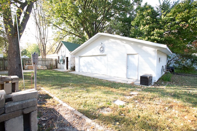 garage with a lawn