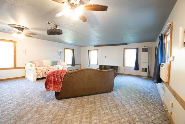 carpeted living room with ceiling fan and a textured ceiling