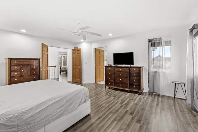 bedroom featuring ceiling fan and hardwood / wood-style floors