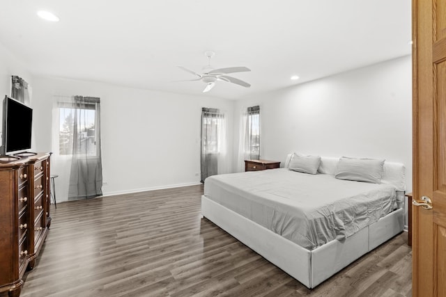 bedroom featuring ceiling fan and dark wood-type flooring