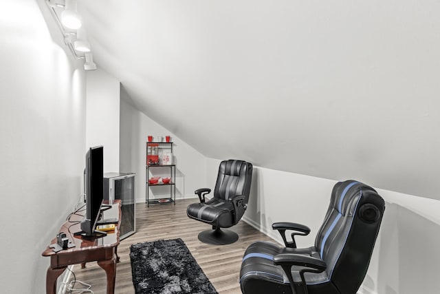 sitting room featuring light hardwood / wood-style flooring and vaulted ceiling