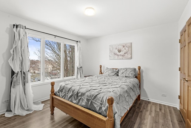 bedroom featuring dark hardwood / wood-style flooring