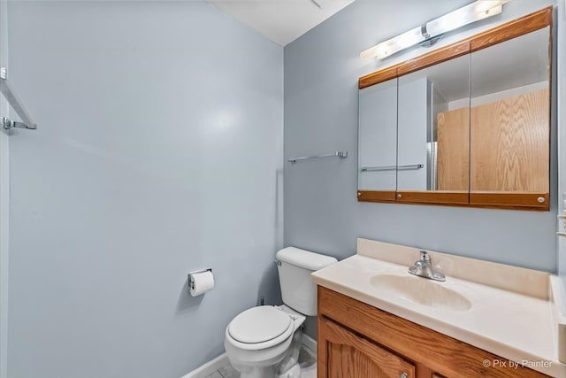 bathroom with vanity and toilet