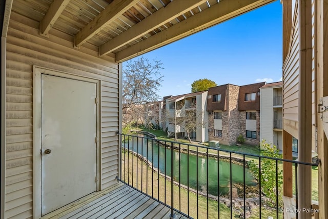 balcony featuring a water view