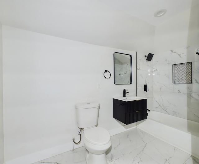 bathroom featuring toilet, vanity, and a tile shower