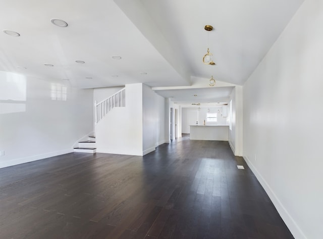 unfurnished living room with lofted ceiling and dark hardwood / wood-style flooring