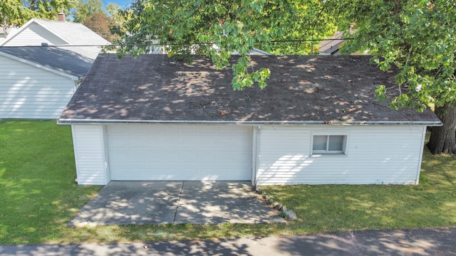 garage with a lawn