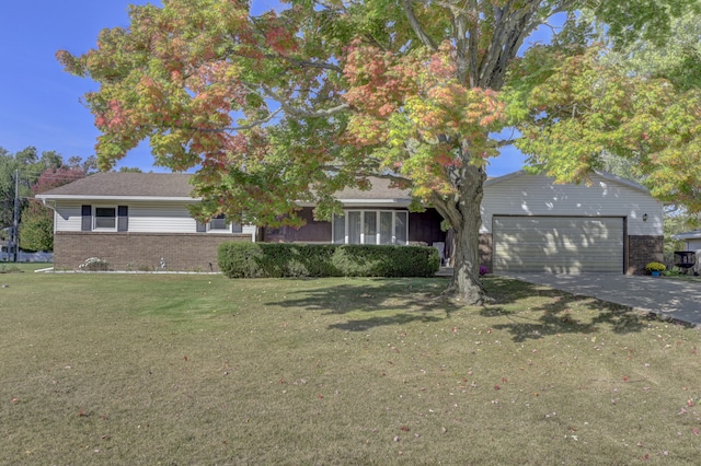 view of front of home with a garage and a front lawn