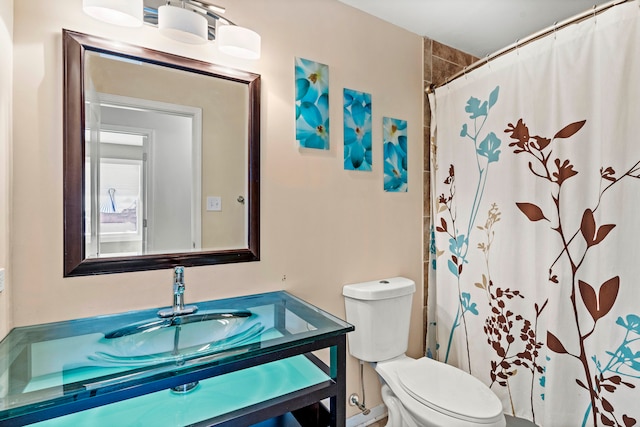 bathroom with vanity, toilet, and a shower with shower curtain