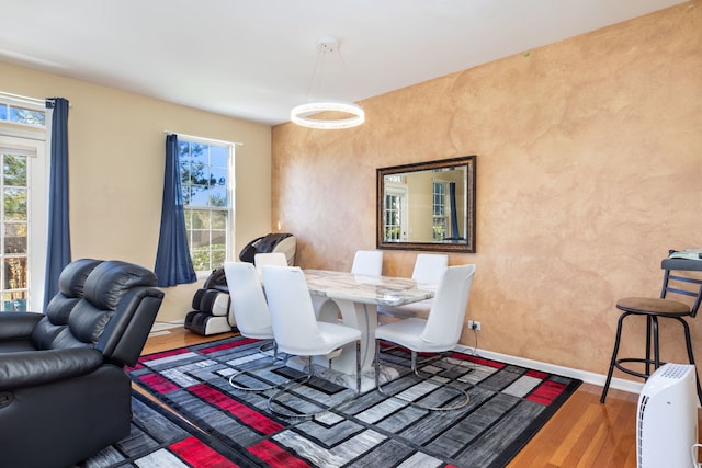 dining area with wood-type flooring