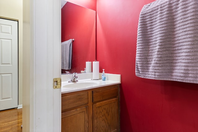 bathroom featuring vanity and wood-type flooring