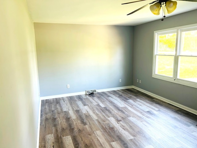 empty room featuring light wood-type flooring and ceiling fan