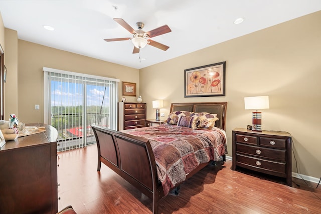 bedroom featuring ceiling fan, access to exterior, and wood-type flooring