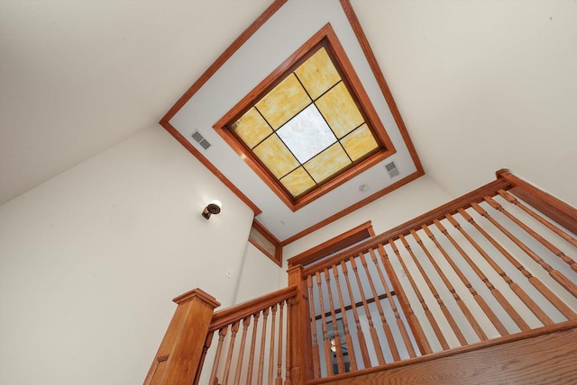 staircase featuring vaulted ceiling