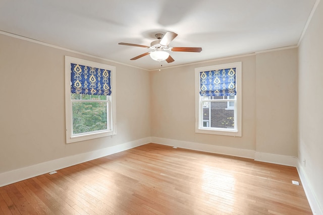 unfurnished room with ornamental molding, light hardwood / wood-style floors, and ceiling fan