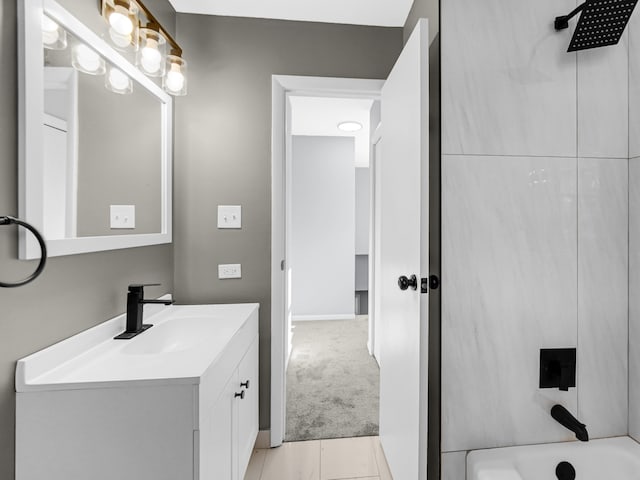 bathroom featuring vanity, washtub / shower combination, and tile patterned floors