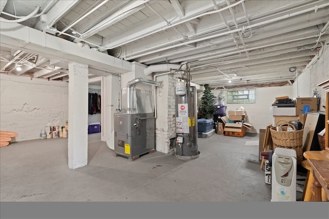 basement featuring heating unit and water heater