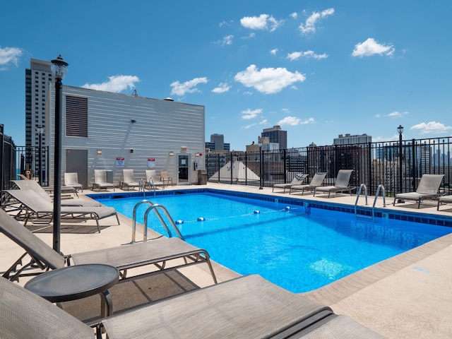 view of swimming pool with a patio