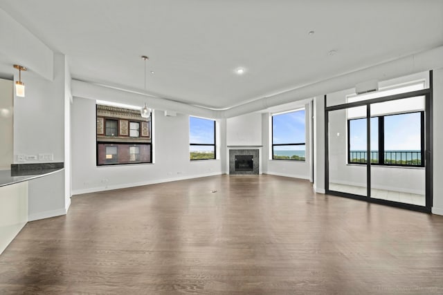 unfurnished living room featuring wood-type flooring