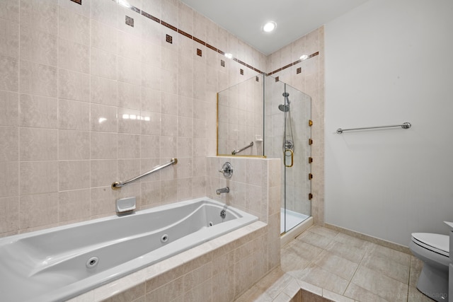 bathroom featuring tile patterned flooring, toilet, and independent shower and bath