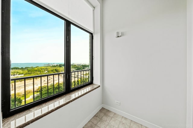 interior space featuring a water view and a wealth of natural light