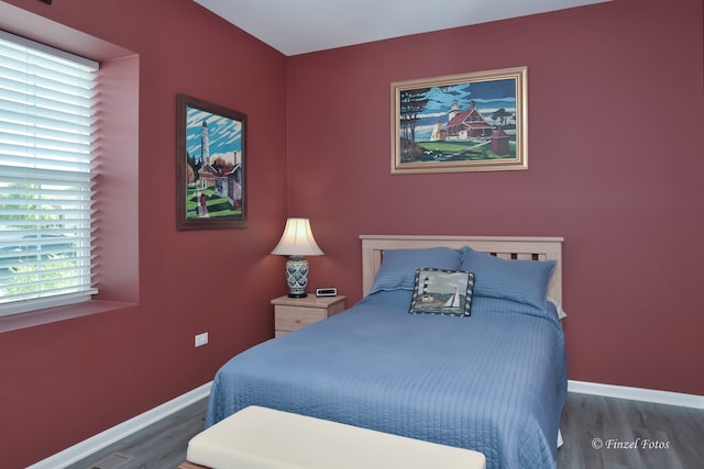 bedroom featuring dark hardwood / wood-style floors