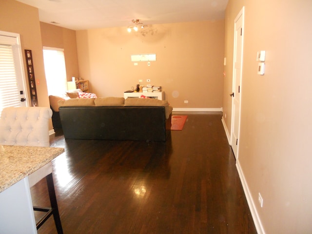 living room with dark hardwood / wood-style floors