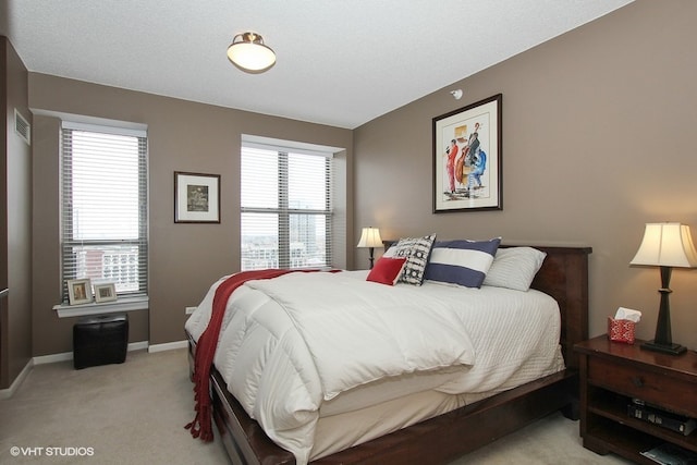 bedroom with light carpet