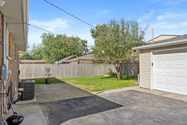 view of patio featuring a garage and central air condition unit