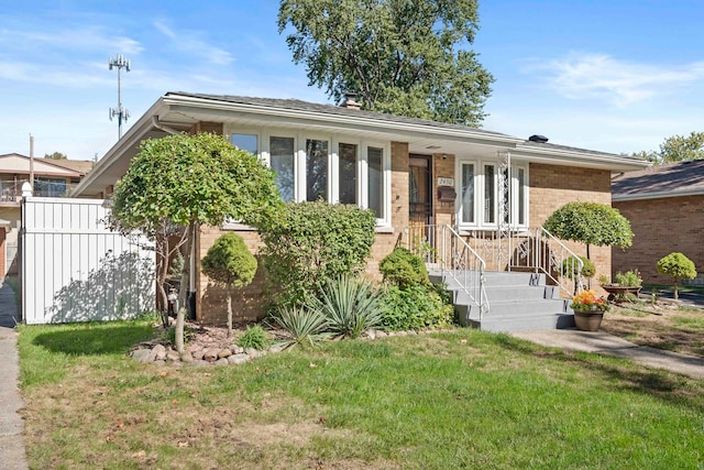 single story home with a front yard