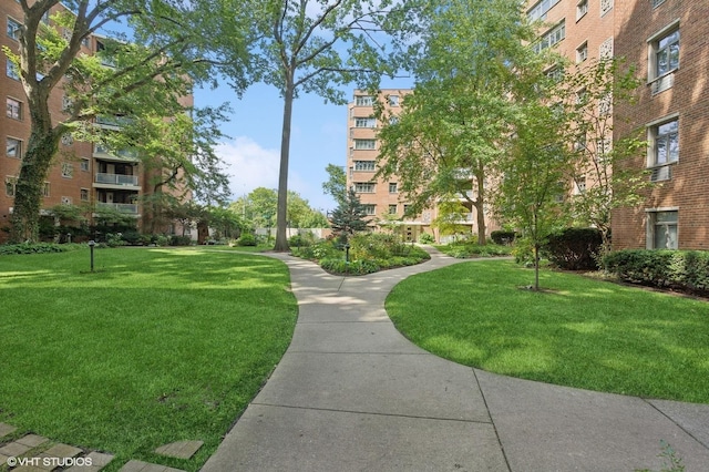 view of home's community with a lawn