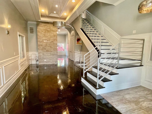 3407 S Calumet Ave, Chicago, IL 60616 - stairway featuring a decorative wall, recessed lighting, arched walkways, a wainscoted wall, and crown molding