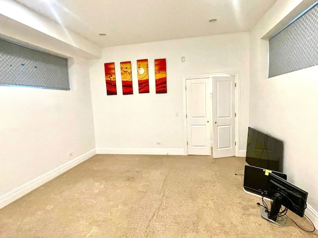 unfurnished room with carpet flooring