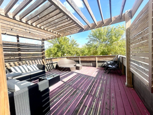 wooden terrace featuring outdoor lounge area and a pergola