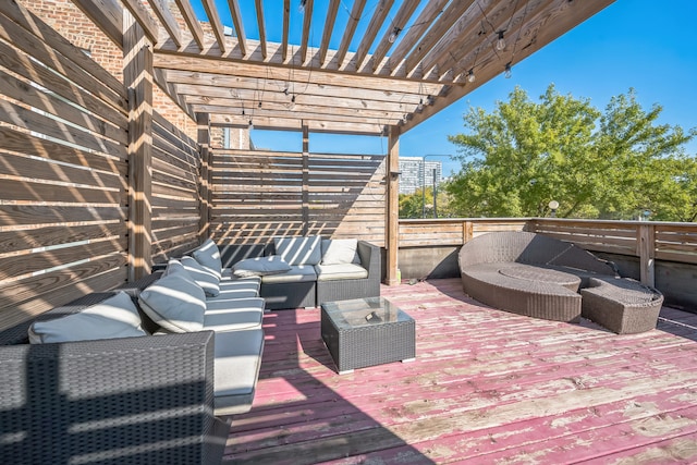 view of patio featuring outdoor lounge area, a deck, and a pergola