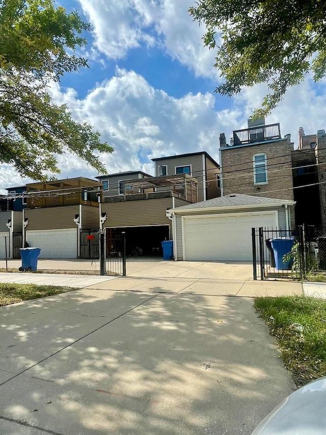 3407 S Calumet Ave, Chicago, IL 60616 - view of front facade with a garage, concrete driveway, and a balcony