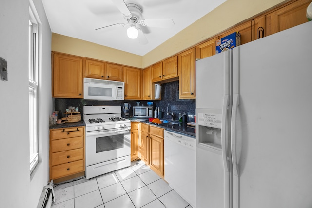 kitchen featuring a baseboard heating unit, backsplash, light tile patterned floors, white appliances, and ceiling fan