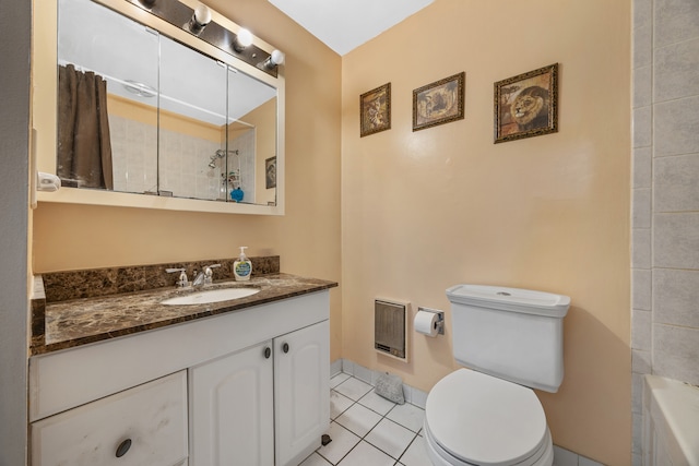 full bathroom featuring toilet, vanity, tile patterned floors, and separate shower and tub