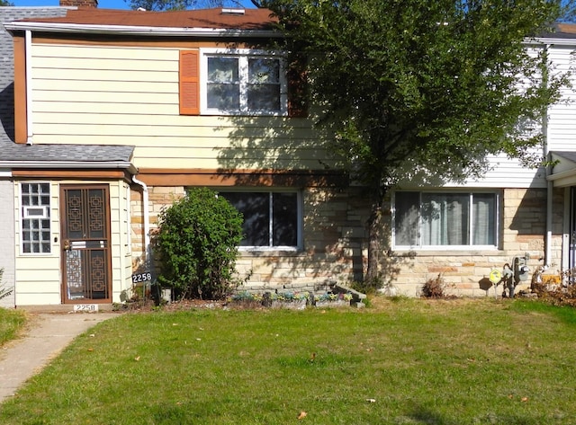 view of front of house with a front lawn