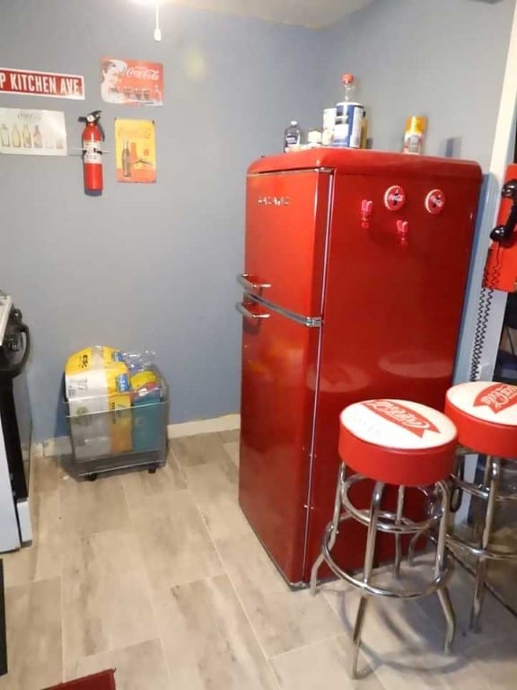 kitchen with stainless steel refrigerator and light wood-type flooring