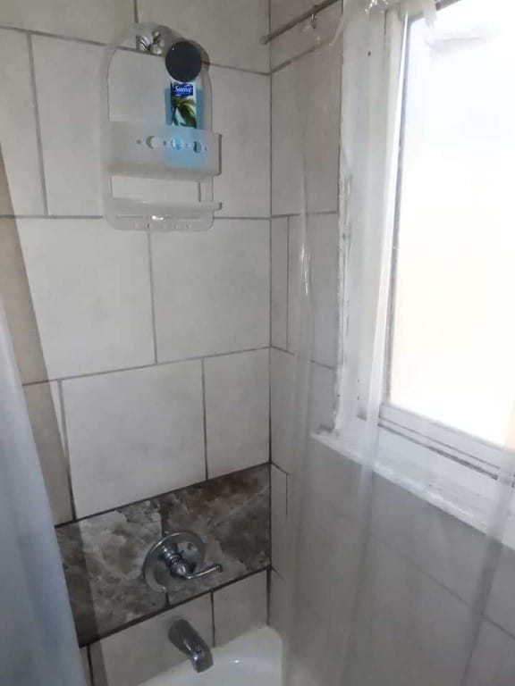 details with tiled shower / bath