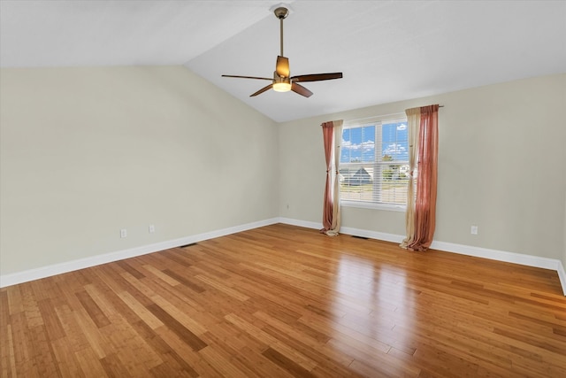 unfurnished room featuring light wood-type flooring, ceiling fan, and vaulted ceiling