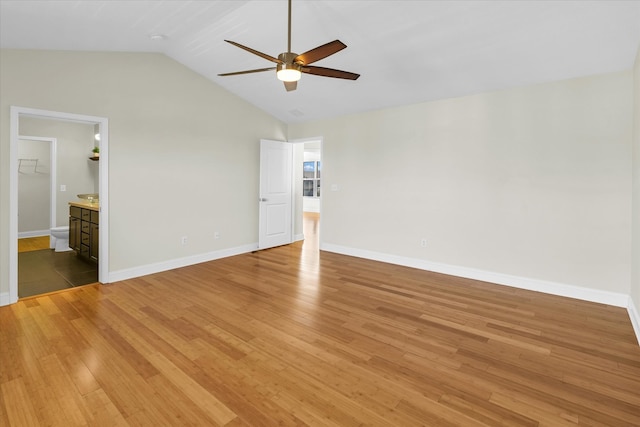 interior space with wood-type flooring, vaulted ceiling, and ceiling fan