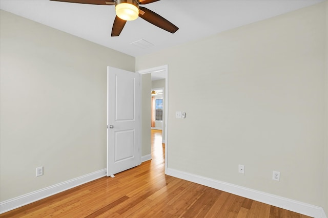 empty room with light hardwood / wood-style floors and ceiling fan