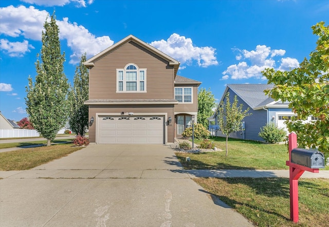 view of front property featuring a garage and a front yard