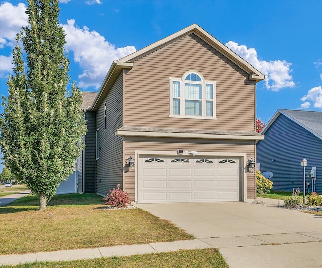 front of property featuring a garage and a front lawn