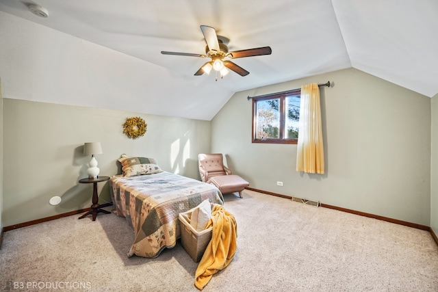 carpeted bedroom with vaulted ceiling and ceiling fan